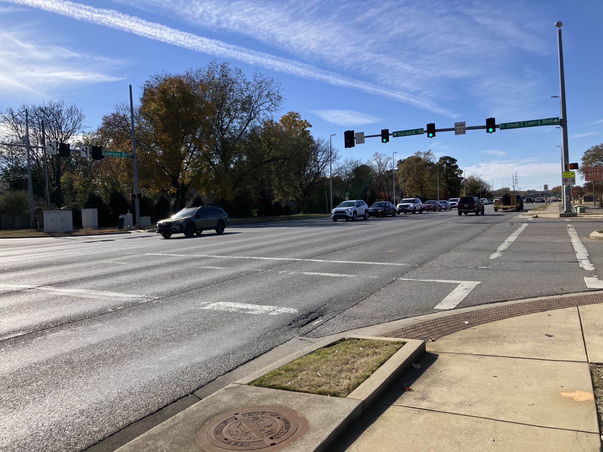 Vehicles moving through intersection on Governors Drive.